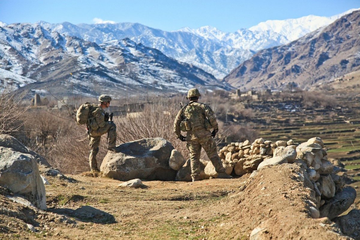 mountain view and two soldiers