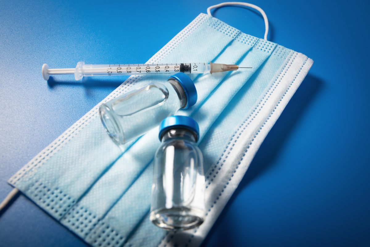 syringe, mask and vaccine